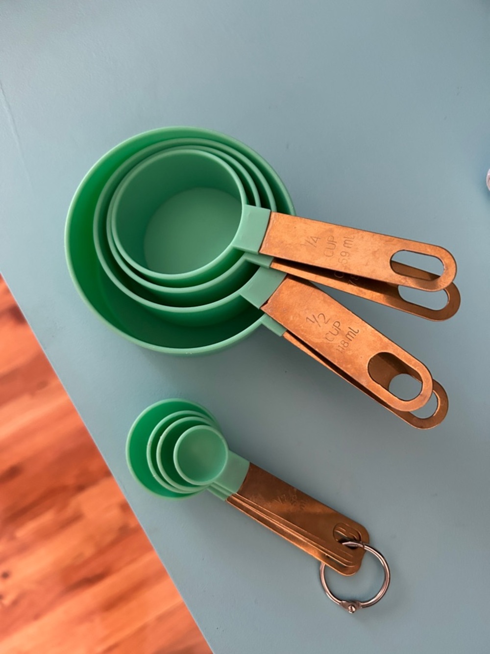 Green Plastic and Copper-Tone Measuring Cup and Spoon Set